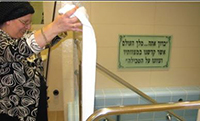 A mikvah attendant making sure the mikvah is clean